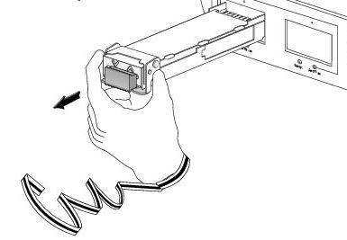 Slide the XFP transceiver module out of the socket